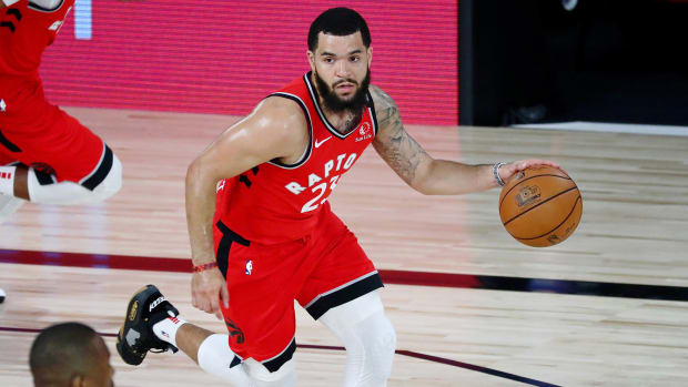 Raptors guard Fred VanVleet dribbles up the court
